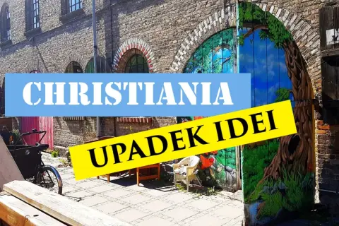Freetown Christiania, z malowaną bramą i rowerem towarowym.