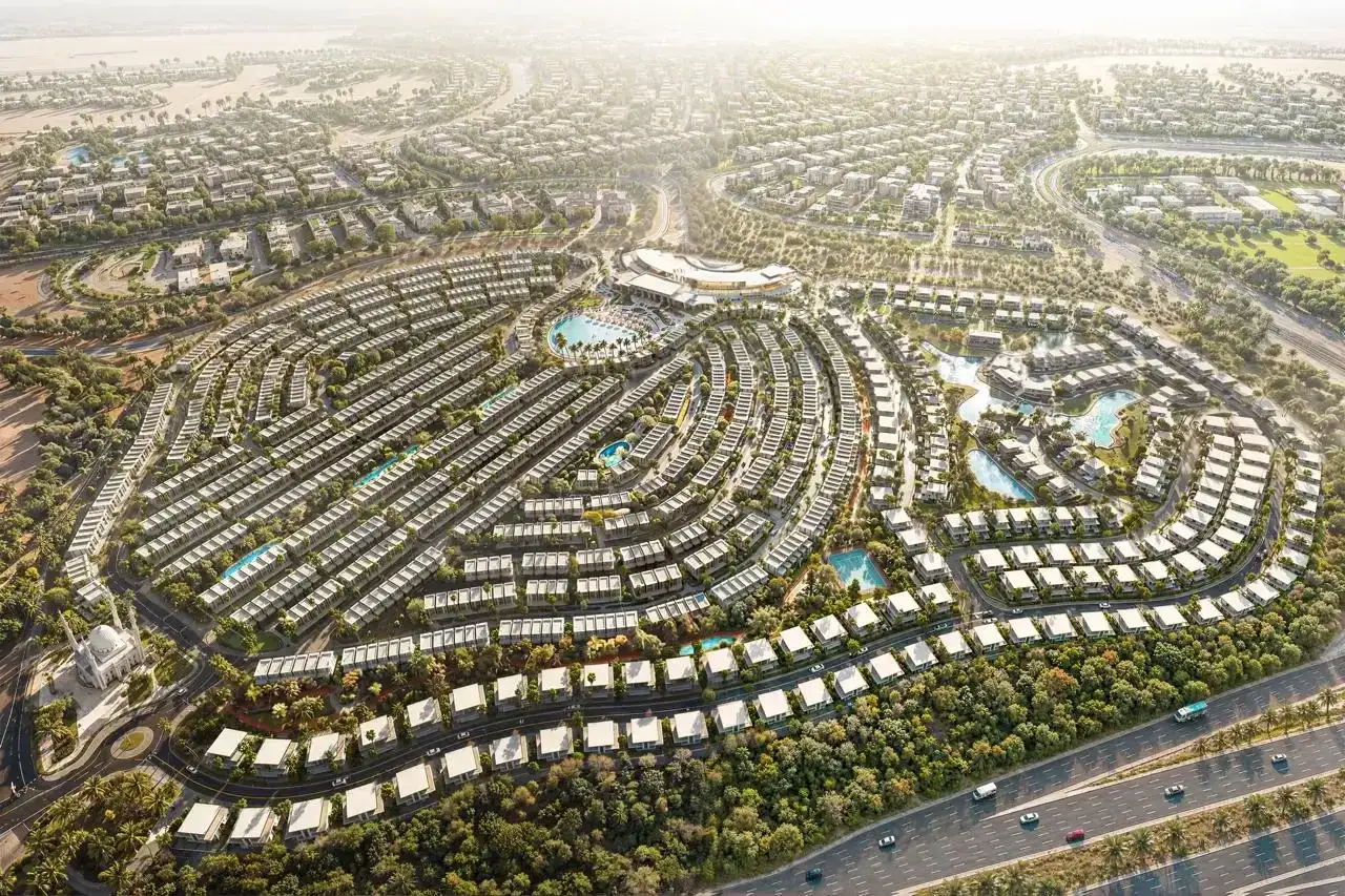 Nowoczesne osiedle z basenami i zielenią, przypominające luksusowe dzielnice w Abu Zabi czy Dubaju.