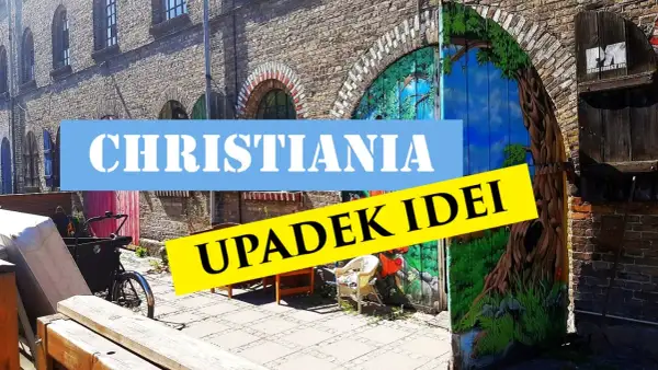 Freetown Christiania, z malowaną bramą i rowerem towarowym.